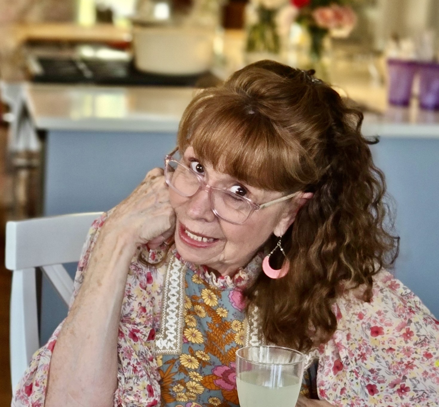Kay DeKalb Smith in a garden setting, warm and approachable